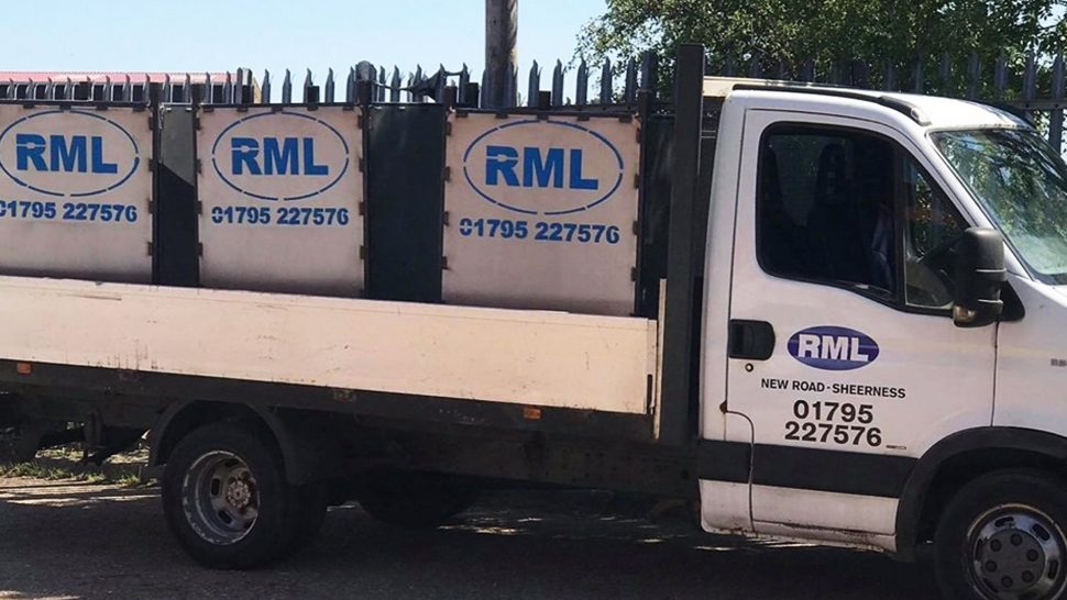 RML metal bins sitting on the back of a RML lorry